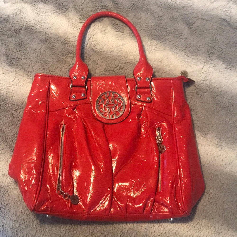 Red Steve Madden should bag with front zip pockets